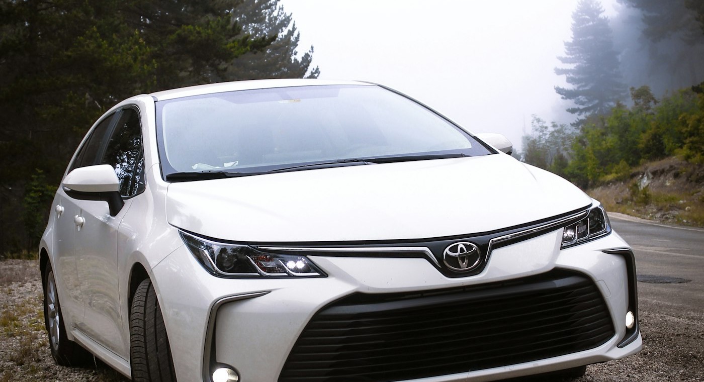 Toyota Corolla sedan on a residential street